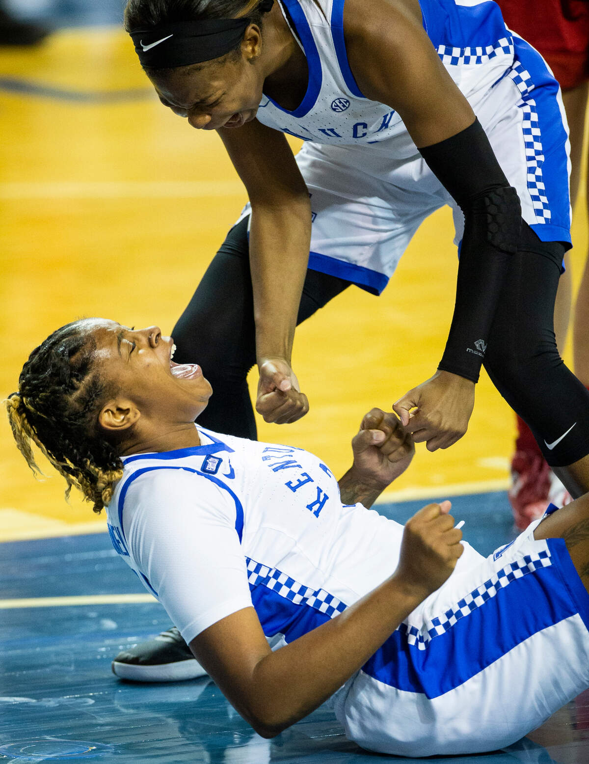 Kentucky Wildcats forward Keke McKinney (3) celebrates with Kentucky Wildcats guard Robyn Benton (1) after drawing a foul while playing defense against the Indiana Hoosiers during the second half of the game at Memorial Colosseum in Lexington, Ky., Sunday, December 6, 2020.