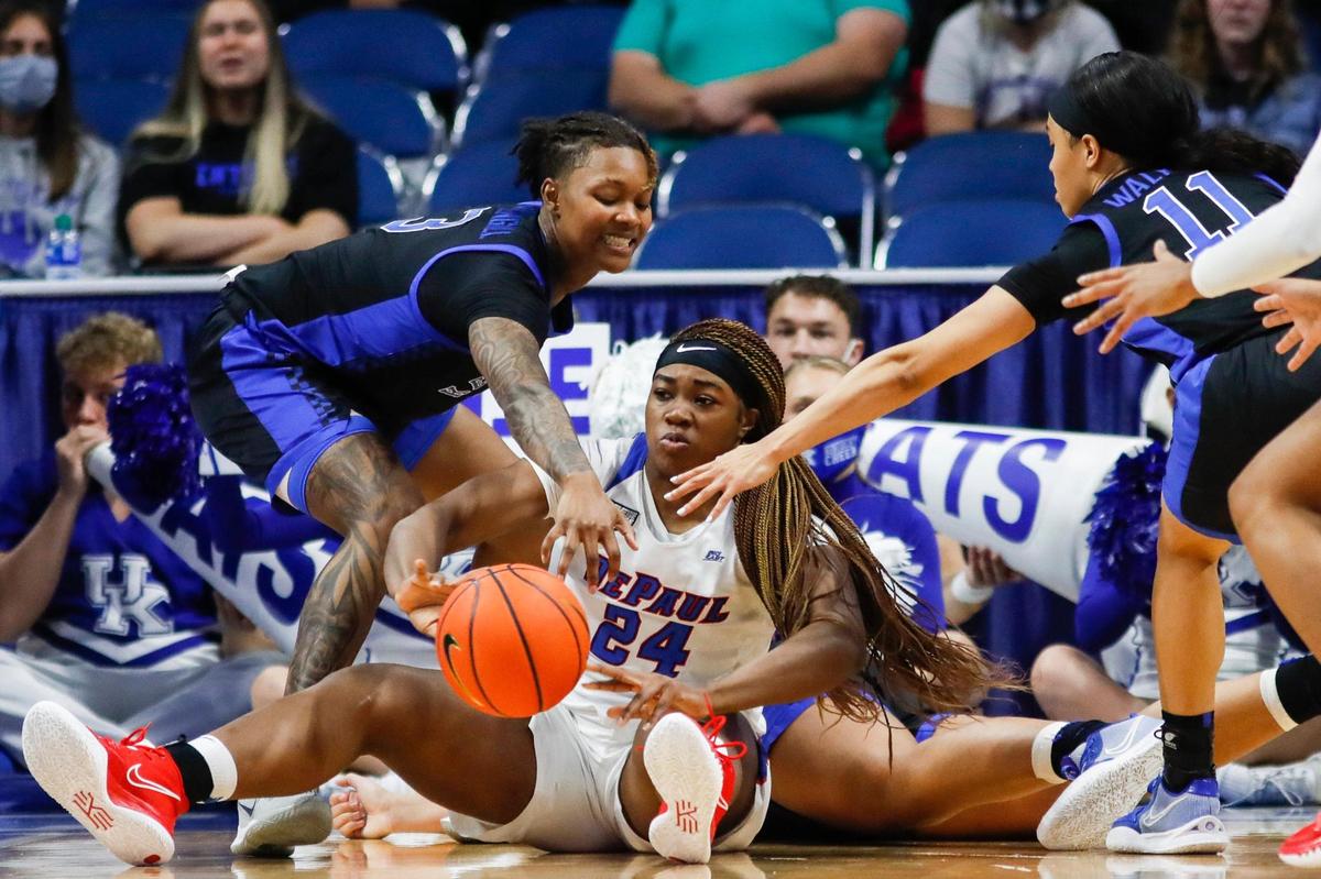 Kentucky’s Jazmine Massengill, left, tries to keep DePaul’s Aneesah Morrow (24) from passing the ball Thursday night.