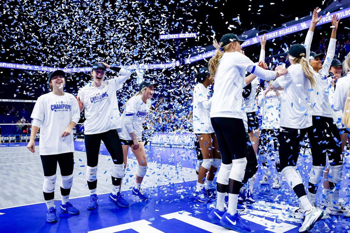 The Kentucky volleyball team celebrates winning the outright SEC championship with a sweep of Florida on Saturday at Rupp Arena.