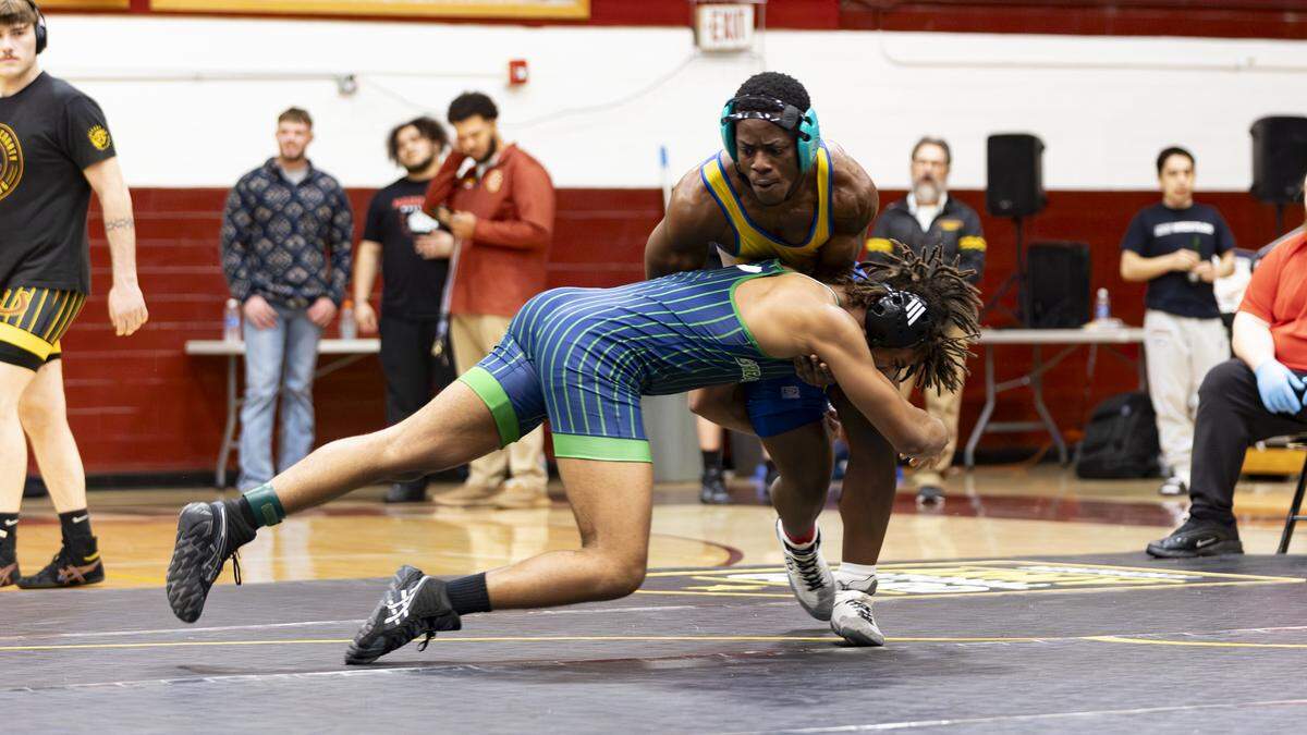 Henry Clay’s Frank Niyonyishu, standing, fended off a rush by Great Crossing’s Cameron Green in the 175 finals at the KHSAA Boys/Co-ed Region 6 Wrestling Championships at Harrison County High School on Saturday.