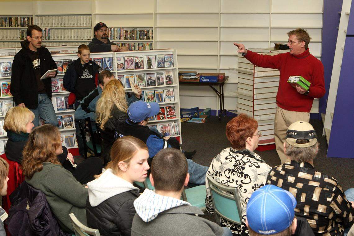 Auctioneer Jamie Bates solicits bids as he auctions a bundle of games during an auction of merchandise and all store fixtures January 26, 2008 in the former Blockbuster store at Lexington’s Brighton Place Shops. In the summer of 2008, six Lexington Blockbuster locations closed, leaving the city with four locations open. The last Lexington locations closed in 2012.