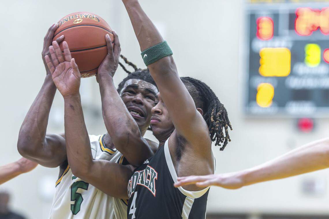 Frederick Douglass' Dakari Talbert (4) defends Bryan Station's Amari Owens (5) during a game at Bryan Station High School in Lexington, Ky., on Thursday, Feb. 5, 2026.