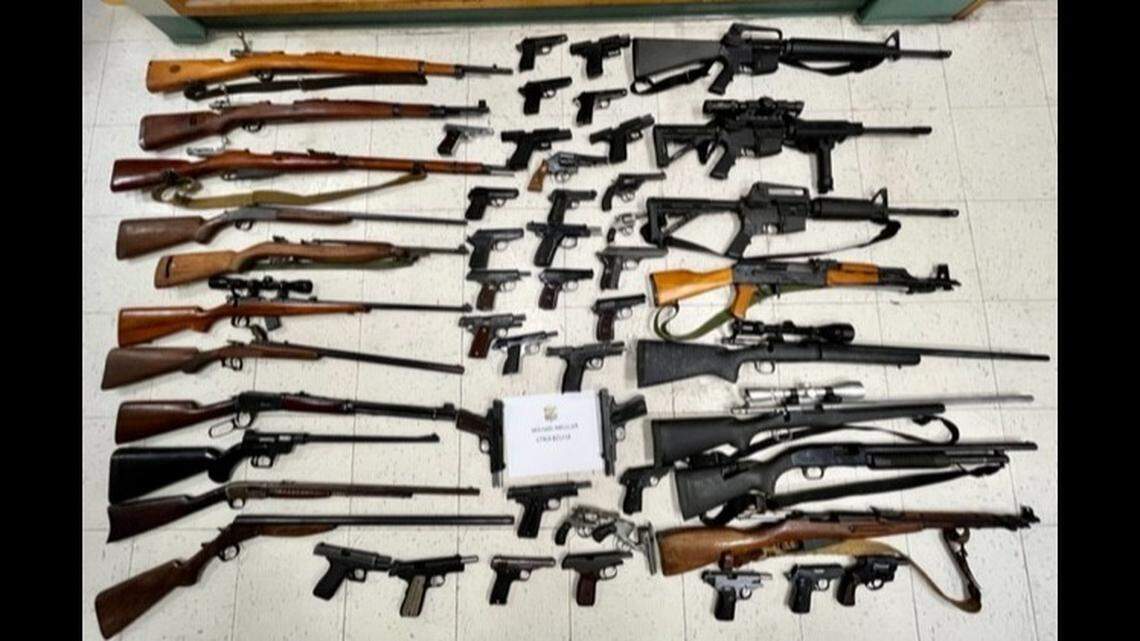 Police say they found 52 firearms while searching the residence of Michael Mueller, the man accused of killing his brother in Deer Park, Ohio, before fleeing to Kentucky where he was found dead.