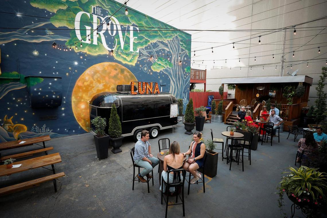 The new mural highlights an outdoor dining area at The Grove.