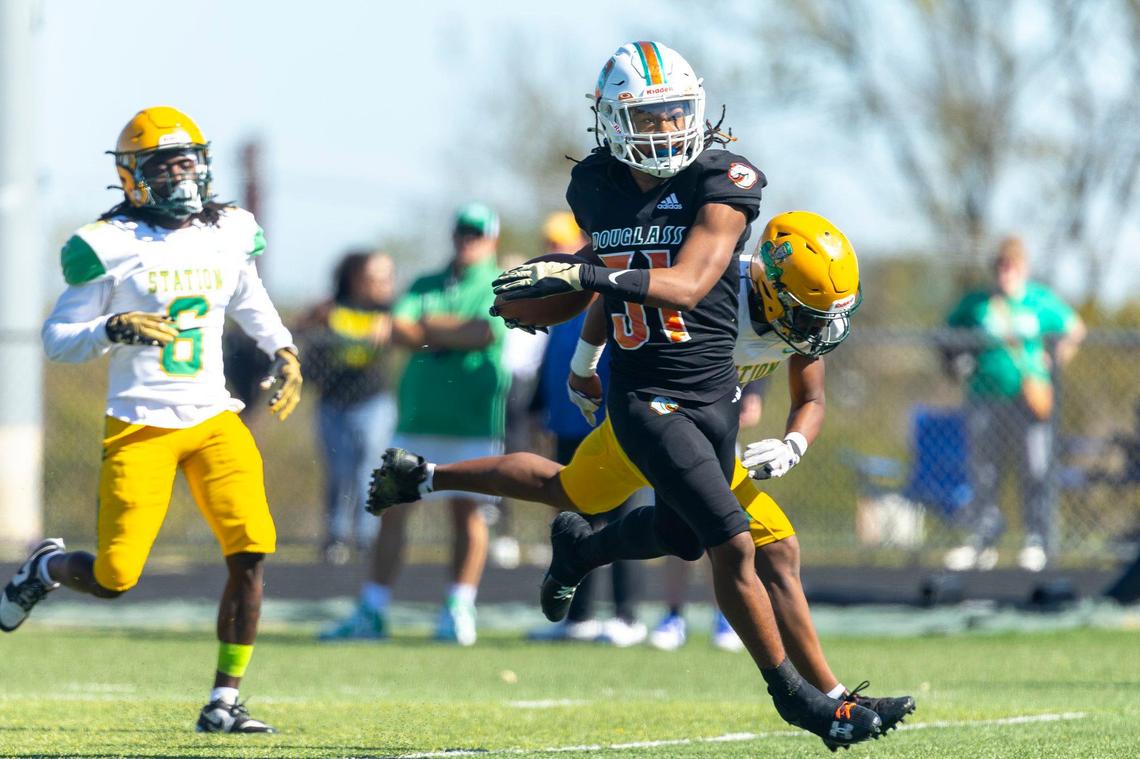 Frederick Douglass running back Dakari Talbert (31) runs for a touchdown against Bryan Station last season