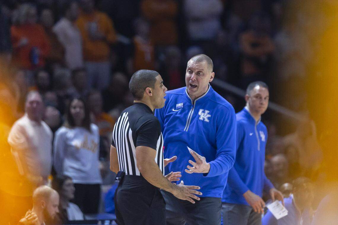 Kentucky head coach Mark Pope talks with an official during Tuesday’s game against Tennessee at Thompson-Boling Arena in Knoxville, Tenn.