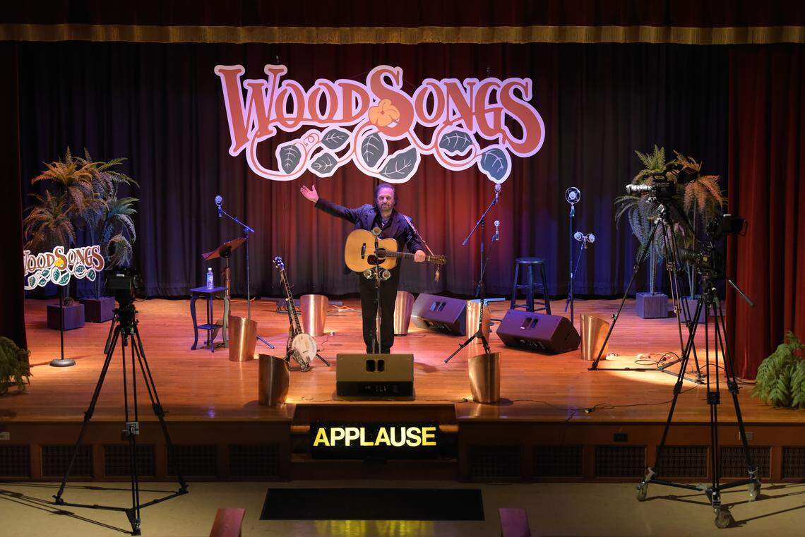 WoodSongs Old-Time Radio Hour host Michael Johnathon on the stage of the shows new home, Scottish Rite, located on the corner of Rosemont Garden and Clays Mill Road.