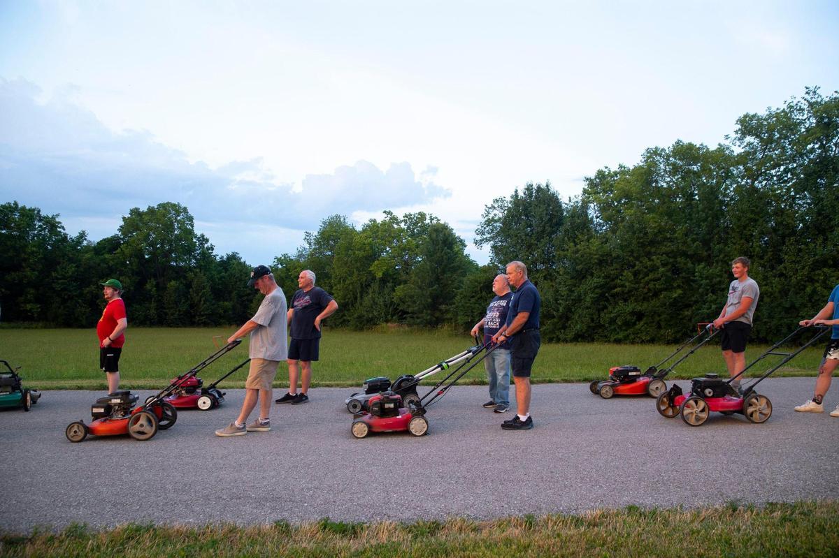 Members of this year’s Wilmore Lawnmower Brigade range in age from 13 to mid-70s. The group practiced its maneuvers on Thursday, June 30, 2022, in Wilmore, Ky.