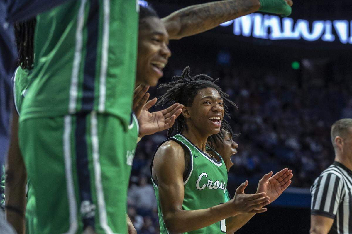 The Great Crossing bench cheers during Friday’s win, which sent the Warhawks to Saturday’s semifinals in the school’s first state tournament appearance.