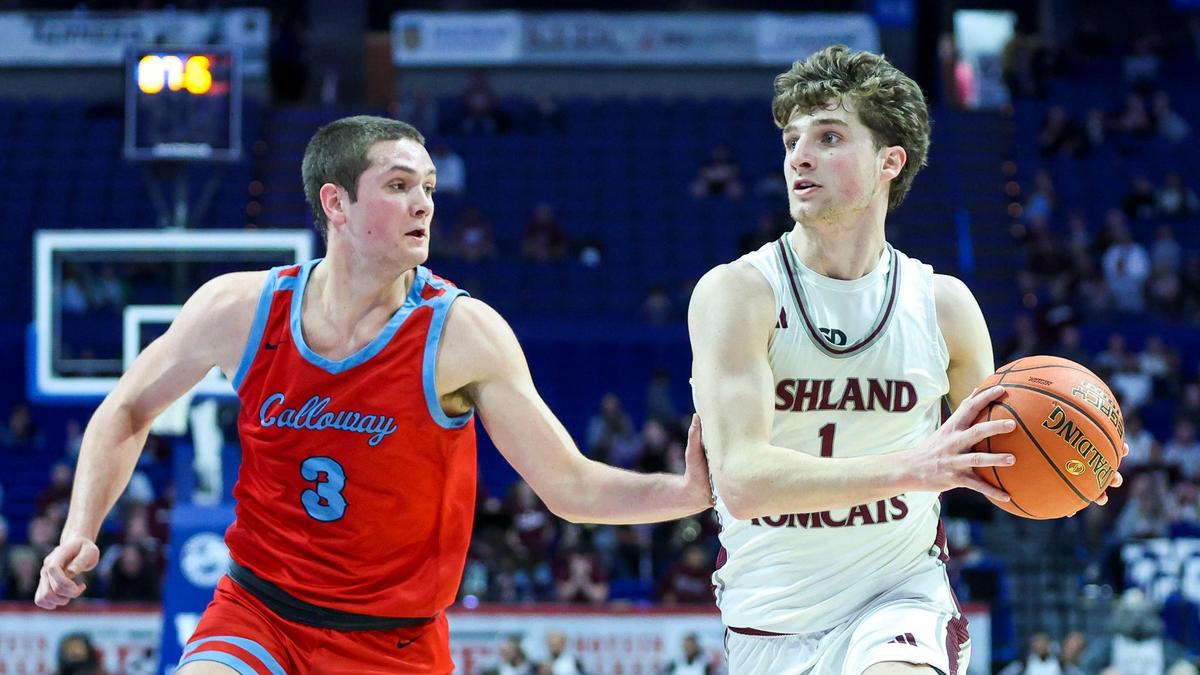 Ashland Blazer’s Zander Carter (1) drives past Calloway County’s Jonah Butler (3). Carter scored 22 of his 29 points in the second half as the Tomcats pulled away.