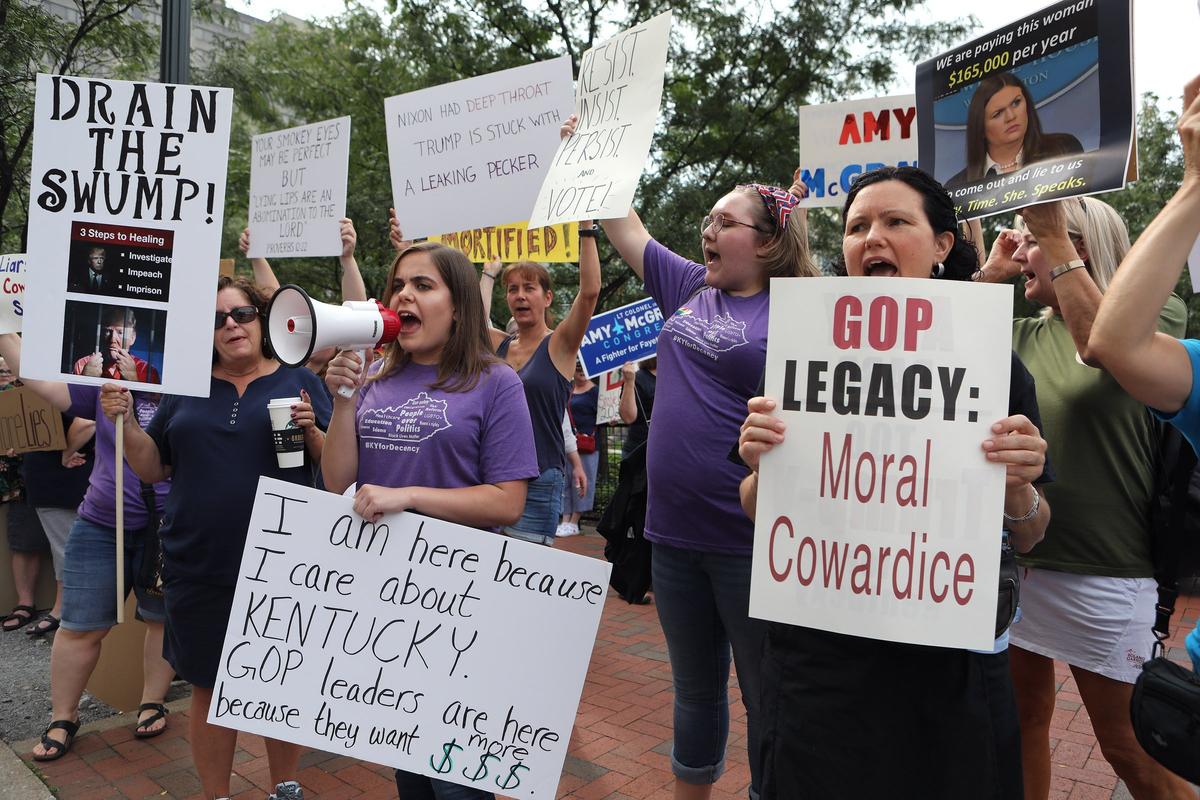 McKayla Weaver chanted ‘this is what democracy looks like’ as she and other protesters demonstrated in Triangle Park across from the site of the Kentucky GOP’s Lincoln Dinner.