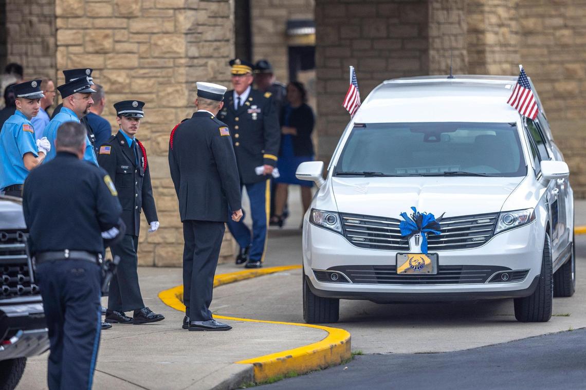 Family, friends and community members arrive for the funeral for Jacob Chaffins at the Mountain Arts Center in Prestonsburg, Ky., on Thursday, July 7, 2022. Chaffins, a Prestonsburg police officer, was killed in the line of duty last week.
