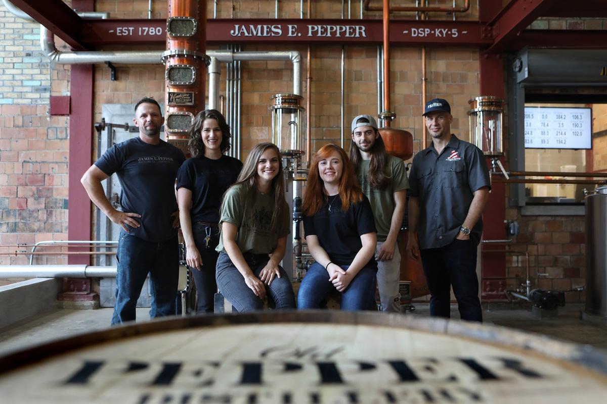 Master distiller Aaron Schorsch, far left, and proprietor Amir Peay, far right, with team members, from left Marjorie Amon, Alex Keeling, Jenna Dowell and distiller Cody Giles at James E. Pepper Distillery on Manchester Street in 2018.