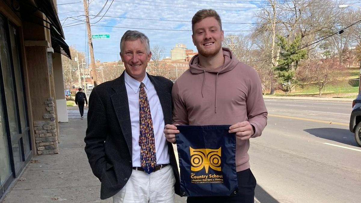 John Fixx, headmaster of and cross country coach at The Country School in Madison, Conn., visits with Kentucky quarterback Will Levis, who attended The Country School through eighth grade, prior to the USATF National Junior Olympics Cross Country Championships, scheduled for Saturday in Paris, Ky.