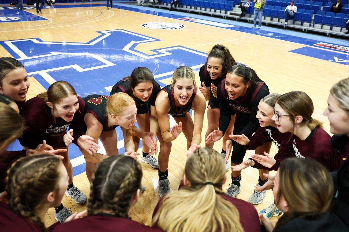Russell’s players huddle before squaring off against McCracken County on the opening day of the Girls’ Sweet 16 in Rupp Arena.