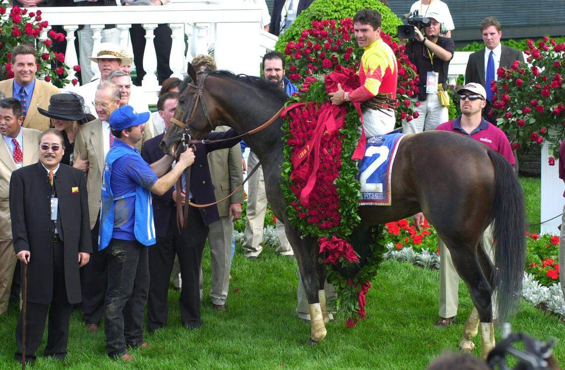 Fusaichi Pegasus stood in the winner's circle with owner Fusao Sekiguchi, left, and jockey Kent Desormeaux after the 126th running of the Kentucky Derby May 6, 2000.