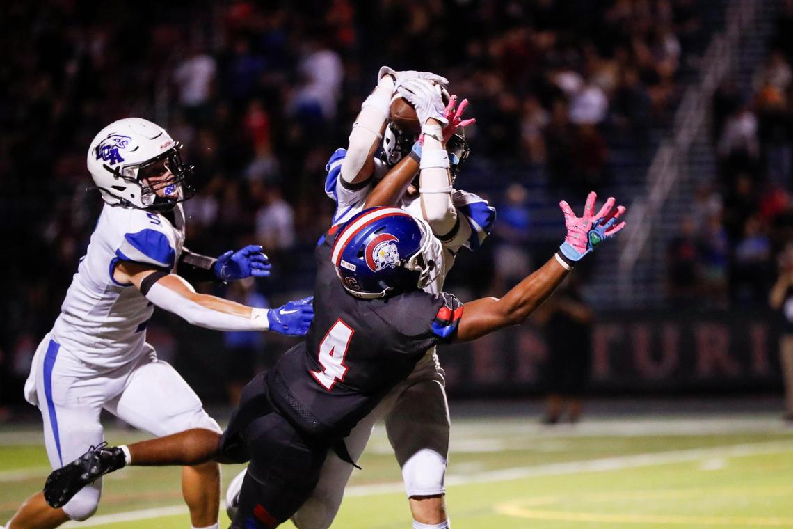 Lexington Christian Academy’s Jackson Dillow (13) intercepts a pass meant for Christian Academy-Louisville’s Justin Ruffin (4) during their game at CAL on Sept. 8, 2023.