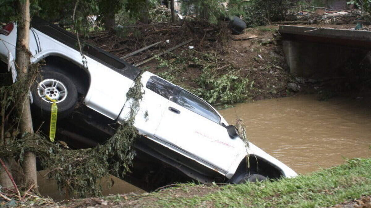 A truck ended up along the banks of  Raccoon Creek. About 100  vehicles were  damaged.
