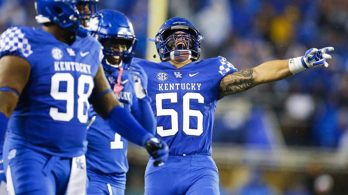 Kentucky linebacker Kash Daniel (56) motioned to the crowd during Kentucky’s 28-7 win over Mississippi State last Saturday at Kroger Field. The Wildcats host South Carolina this week looking to prove they can handle prosperity.