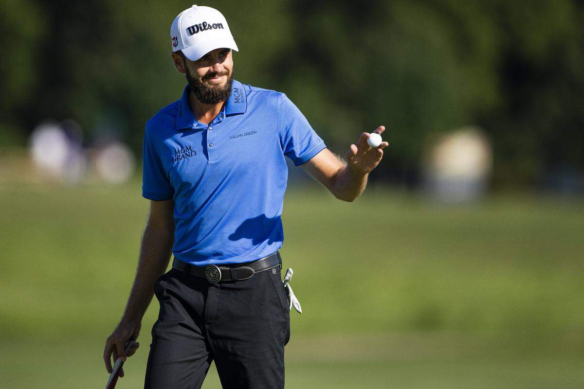Troy Merritt celebrated after sinking a putt on the ninth hole during the PGA Tour Barbasol Championship at Keene Trace Golf Club Thursday in Nicholasville. Merritt finished 10-under par for the day and leads the tournament.