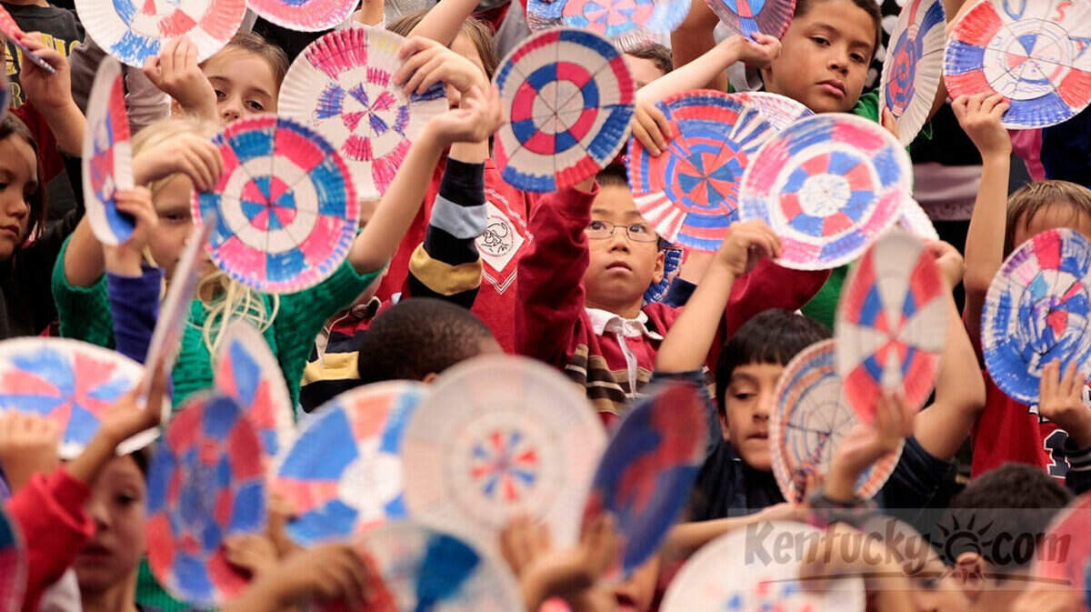 Liberty Elementary students performed a rhythmic movement with hand-painted paper plates to American Salute during a Veteran's Day program Monday at Liberty Elementary. The music is based on When Johnny Comes Marching Home. Students created patriotic designs on the paper plates in art class. Photo by Pablo Alcala | Staff