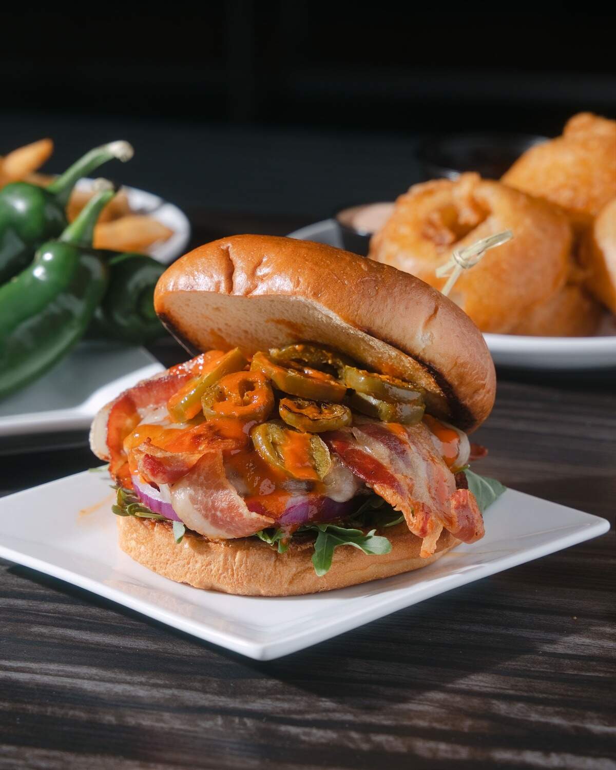 LexLive’s Sweet Sting burger is topped with provolone, bacon, grilled jalapeños, arugula, red onion and LexLive’s signature Honey Hot Wing Sauce for Lexington Burger Week.