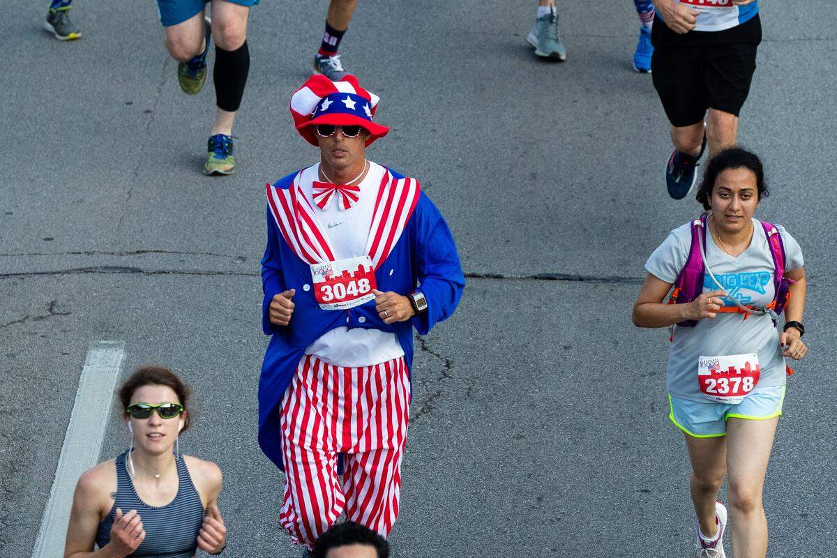 Runners compete in the the Bluegrass 10K in downtown Lexington, Ky., Thursday July 4, 2019.