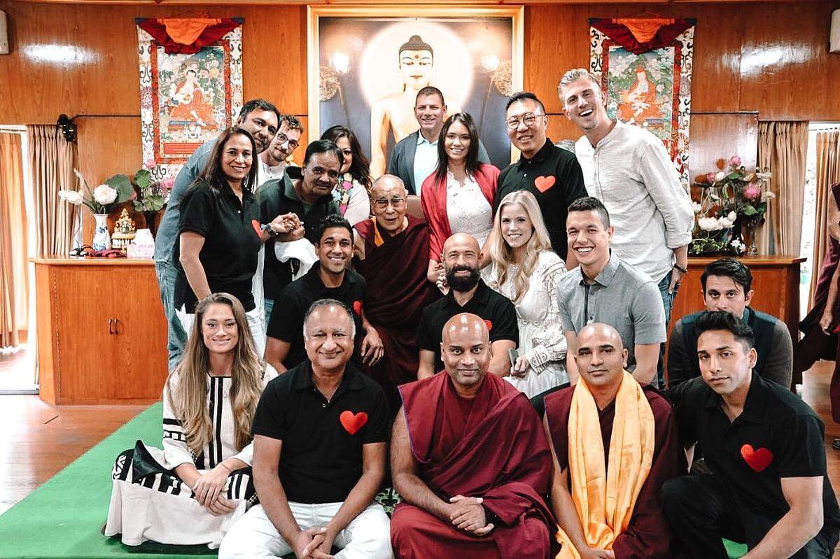 Amy Hehre, middle row, in white, a Kentucky native and graduate of UK and WKU, runs a hospital for orphans and abandoned children with severe medical conditions in Kenya. She recently met with the Dalai Lama.