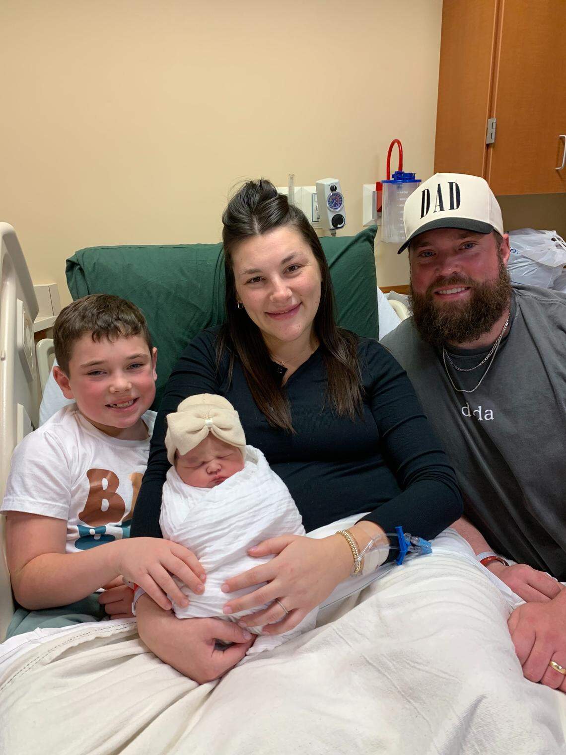 The Ritchie family poses for a photo with a new member, baby Kennedy Rayne, who was the first baby born at the Women’s Hospital at Saint Joseph East Jan. 1, 2026.