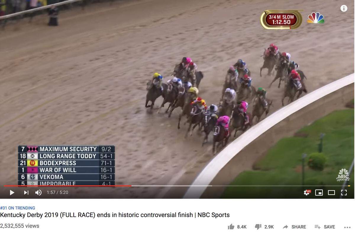 At 1:57 in the Kentucky Derby video, the horses on the lead are going into the turn. Maximum Security, in the pink silks, is in front on the rail with War of Will, also in pink, behind him.