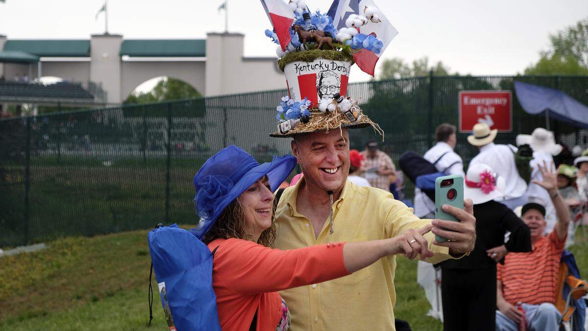Angela Meyer and Bob Burns of Killeen, Texas, took a selfie in the infield at Churchill Downs. This was their first Derby, and he made his hat to combine the symbols of Kentucky and Texas.