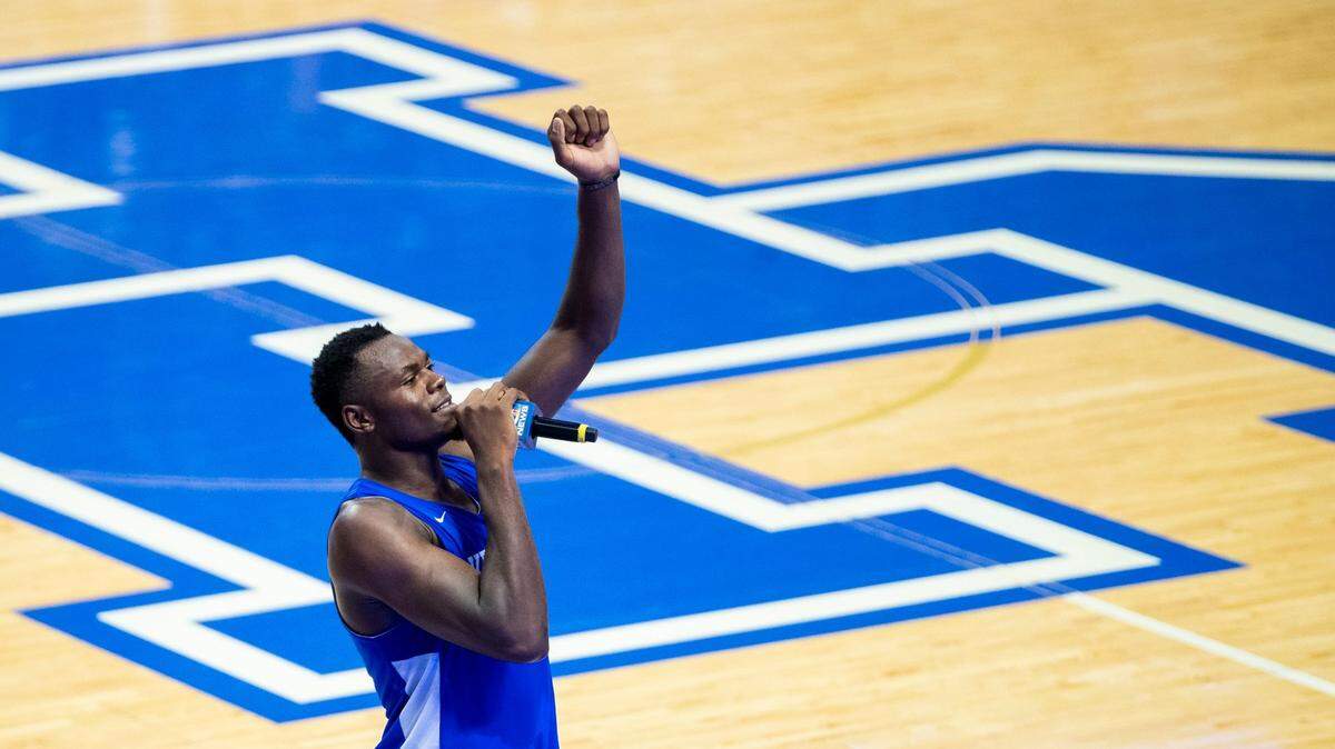 Kentucky player Oscar Tshiebwe (34) speaks to fans gathered during an open practice and telethon to raise money for flood relief at Rupp Arena in Lexington, Ky., Tuesday, August 2, 2022.