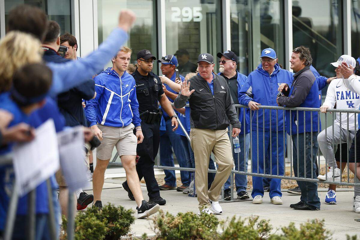 Kentucky Coach Mark Stoops walked with Lexington Catholic quarterback Beau Allen before UK's spring football game last month. Allen gave the Wildcats a verbal commitment Monday for the 2020 class.