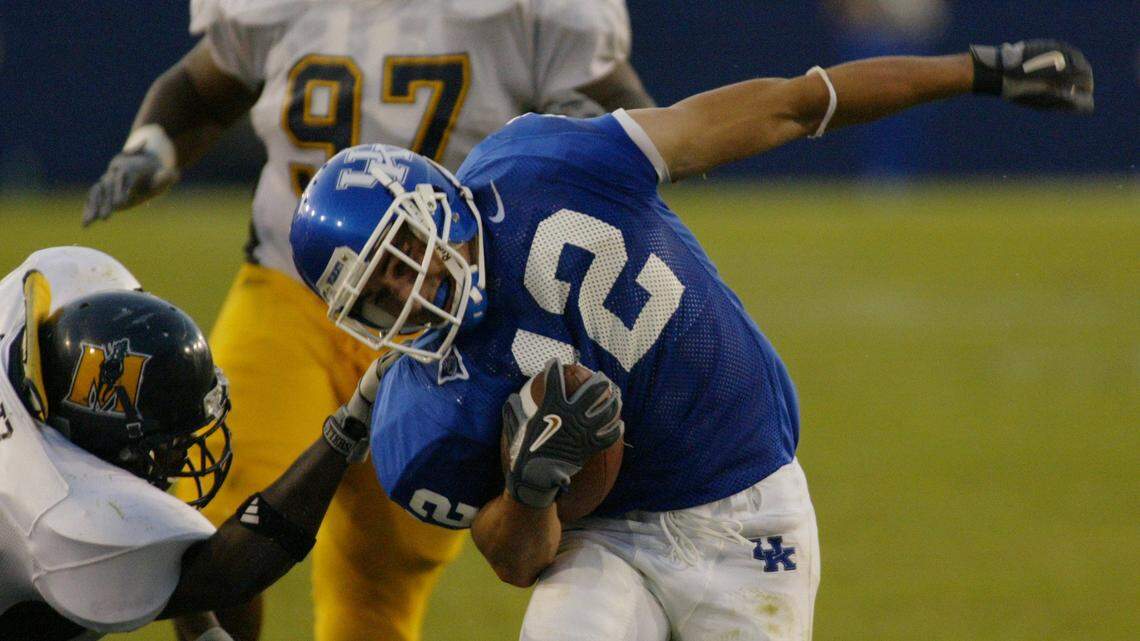 Kentucky’s Derek Abney (No. 12) was twisted out of bounds on a punt return in UK’s 37-6 win over Murray State in the second game of the 2003 season. On Sept. 15, Kentucky and Murray will play again for only the second time ever.