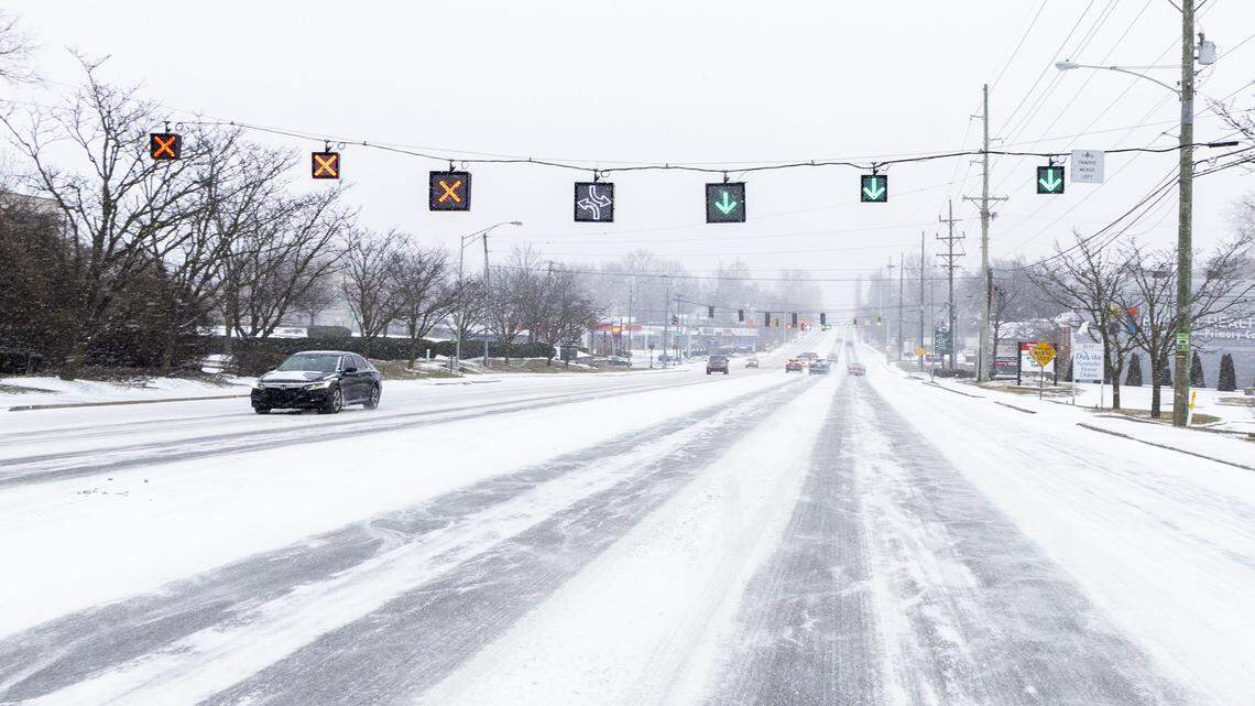 Traffic moves down Nicholasville Road near Southland Drive, Saturday, Jan. 24, 2026, as Winter Storm Fern started to bring heavy snowfall and sleet across Lexington and Central Kentucky.
