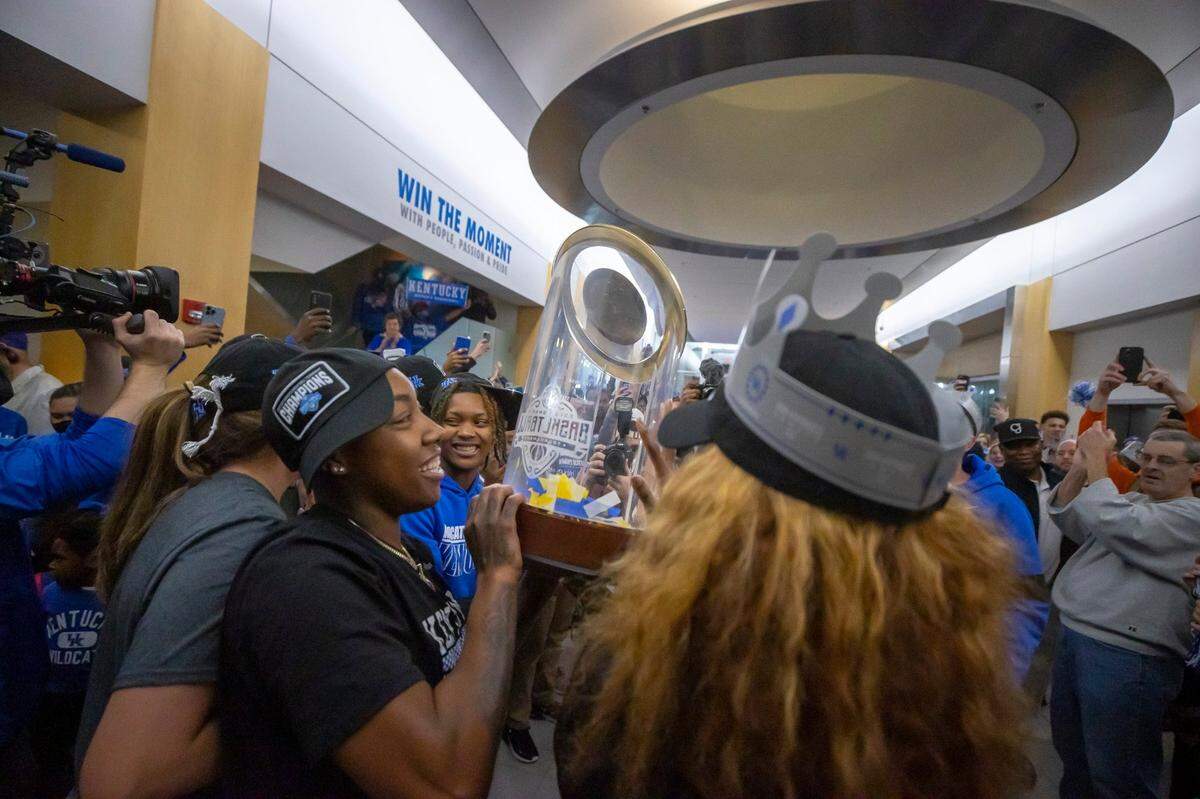 Dre’una Edwards, who hit what proved to be the game-winner for Kentucky in the SEC Tournament championship game, celebrates with her team and its fans at the Joe Craft Center on the UK campus on Sunday night.