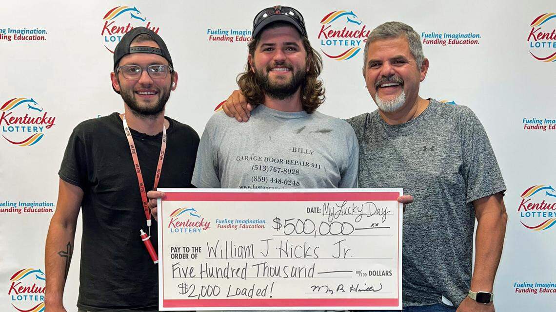 William Hicks Jr., center, scratched off a $500,000 Kentucky Lottery ticket, and will share the winnings with his brother and dad.