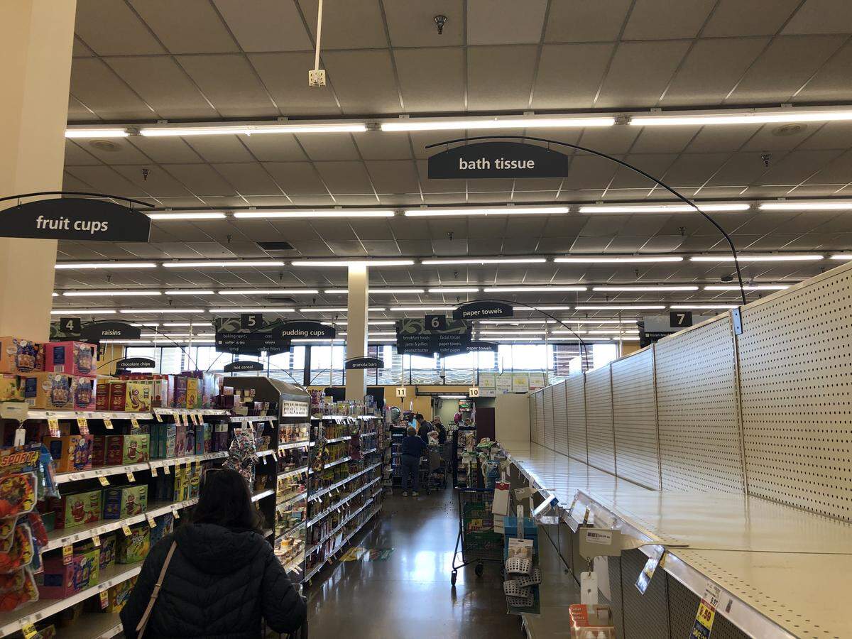 Shelves in the bath tissue aisle of the Kroger on Nicholasville Road were empty on Friday, March 13, 2020, in Lexington, Kentucky.