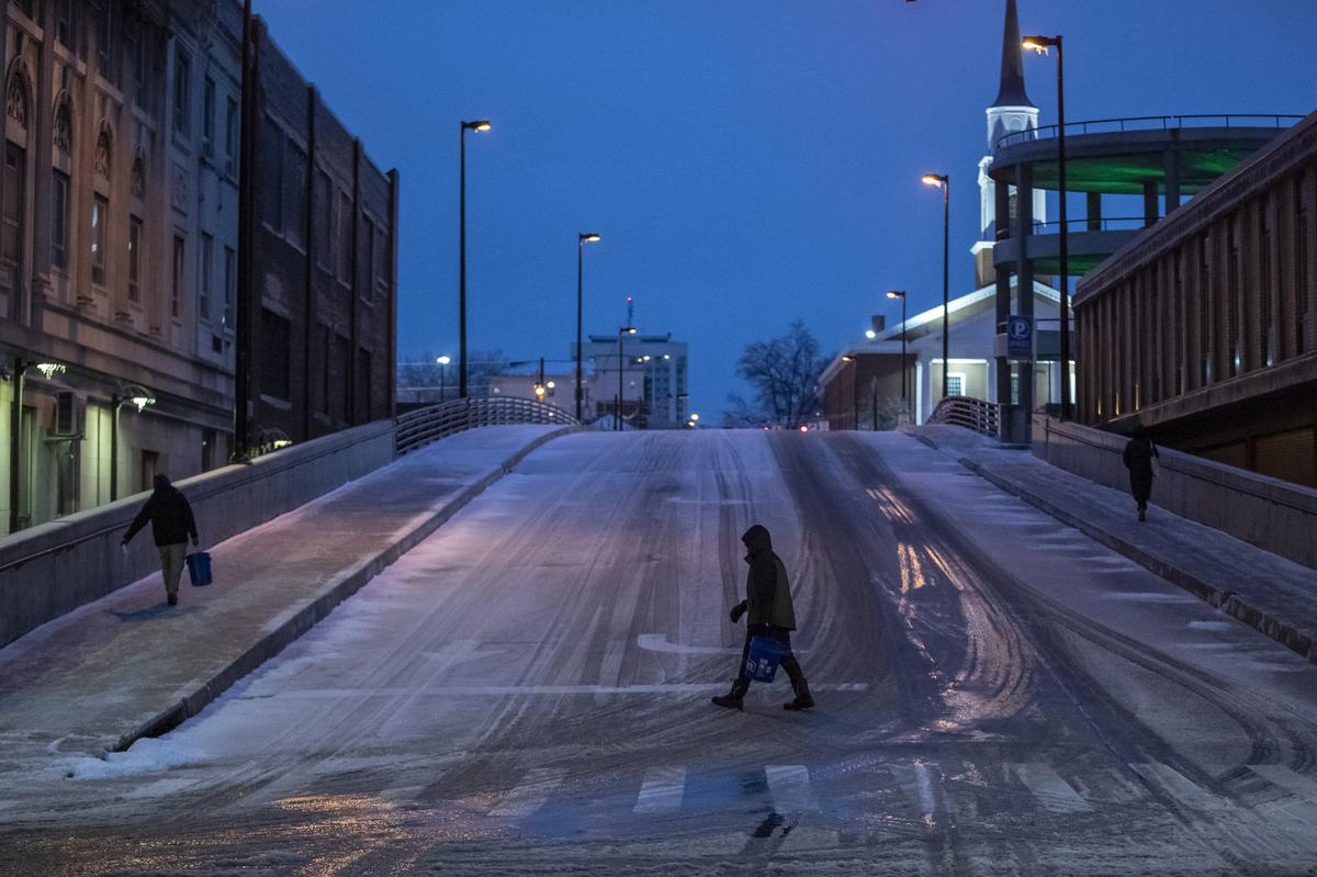 Snow and ice cause a difficult morning commute in Lexington, Ky. on Thursday, Feb. 11, 2021. City officials advised people to stay home if at all possible due to hazardous road conditions.
