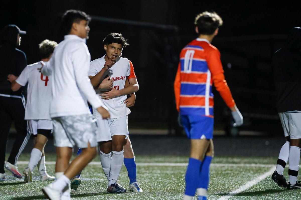 Paul Laurence Dunbar’s Joany “Gio” Chavez talks to Frankfort player after the teams scuffled during the 11th Region Soccer Tournament semifinals at Madison Central High School on Thursday.