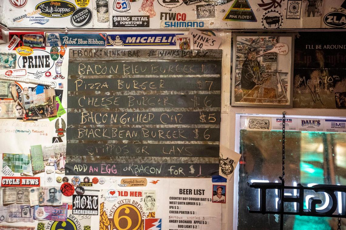 The standing menu at on a wall Wink’s Bar in Richmond is full of burgers. Owner John Dale Warner will have occasional specials such as chicken tacos.