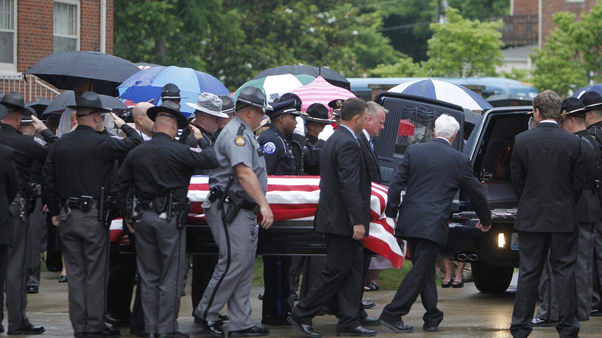 Police officers from several agencies carried the casket of Brett Benton out of First Christian Church on Wednesday in Richmond. The funeral was conducted with full police honors. See a photo gallery at Kentucky.com.