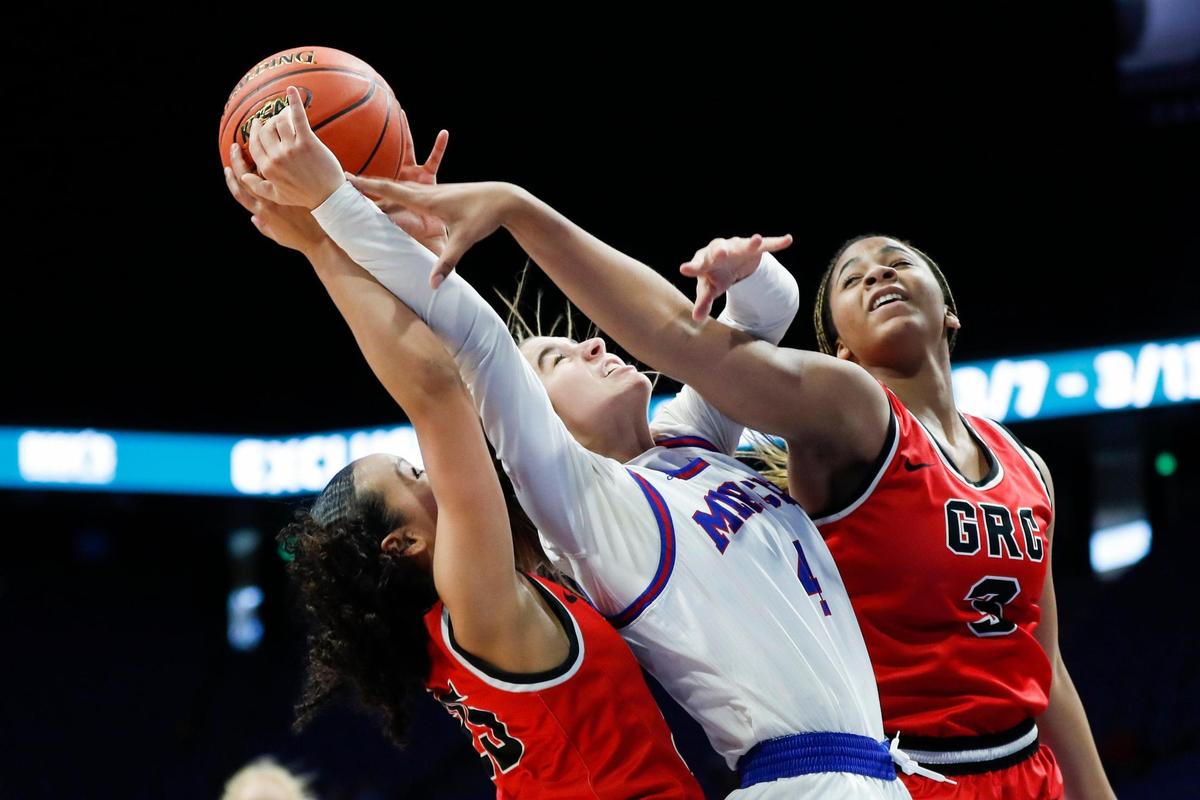 Anna Drakeford (4) battles for a rebound against George Rogers Clark in Rupp Arena. Drakeford led Mercer County with 20 points before fouling out.