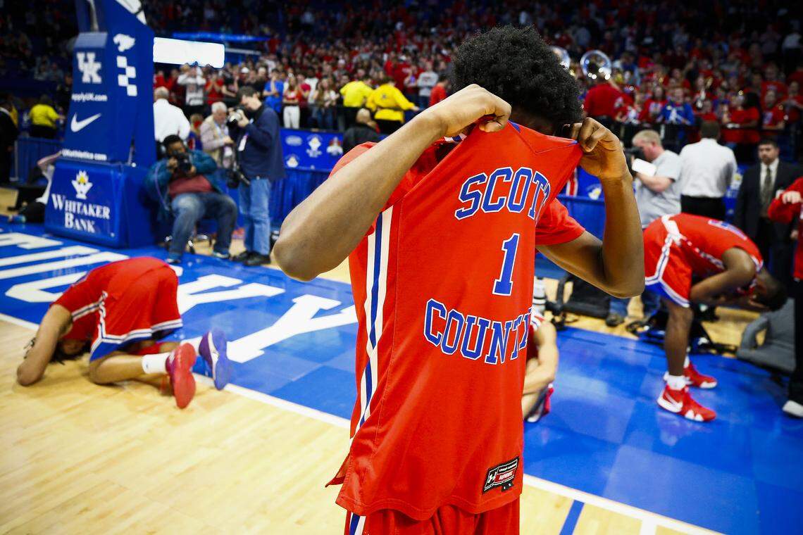 Scott County’s Cam Fluker (1) appeared dejected after the Whitaker Bank/KHSAA BoysÕ Sweet Sixteen championship game against Trinity Sunday at Rupp Arena in Lexington Sunday, March 10, 2019. Trinity beat Scott County 50-40.