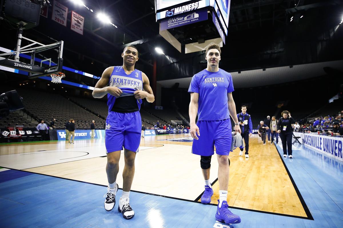Kentucky’s Keldon Johnson, left, and Reid Travis left the floor after Wednesday’s practice in Jacksonville, Fla.