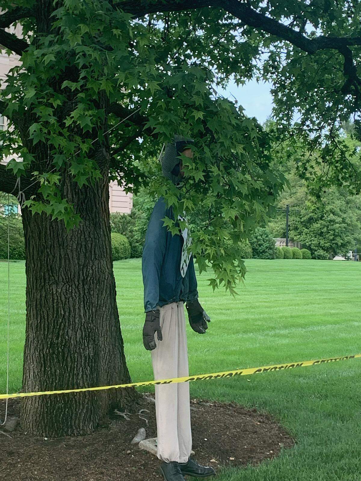 An effigy of Gov. Andy Beshear was hung in a tree during a rally at the Capitol in Frankfort Sunday.