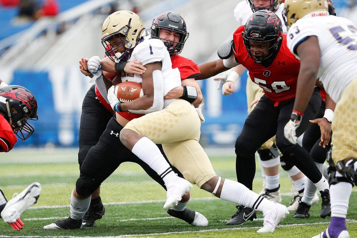 Owensboro’s Austin Gough tackled Bowling Green’s Javeius Bunton during last week’s Class 5A state championship game at Kroger Field.