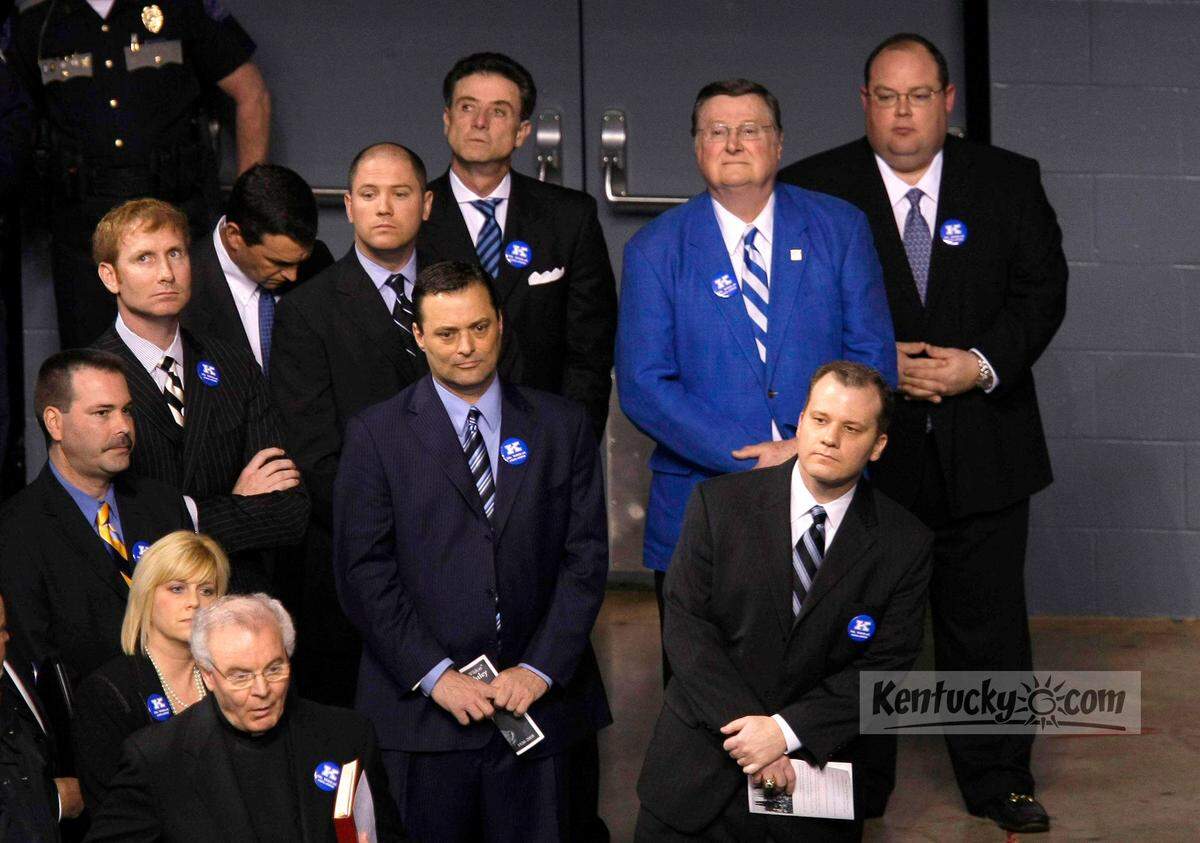 Former Wildcats players Richie Farmer, left, John Pelphrey and Jeff Sheppard, waited with coaches Rick Pitino Joe B. Hall, and Billy Gillispie as they came in with former managers Jeff Morrow, front right, and Vinny Tatum, back right, during the memorial service for UK equipment manager Bill Keightley at Rupp Arena in 2008.