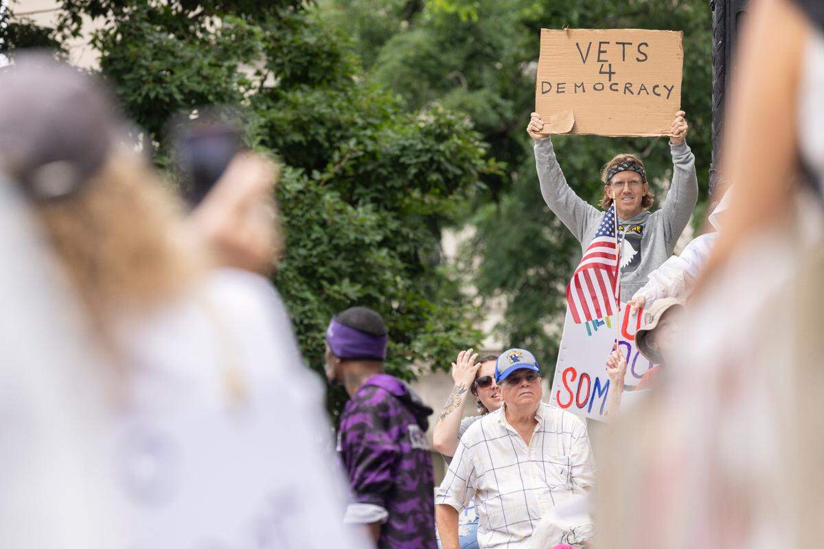 Thousands of demonstrators gathered during the ‘No Kings’ march and protest at Metro Hall in downtown Louisville, Kentucky, Saturday, June 14, 2025. ‘No Kings’ rallies organized across the United States in direct response to President Donald Trump’s military parade in Washington D.C.