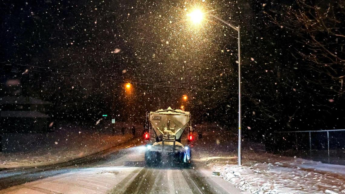 A city of Lexington plow and salt truck drops a layer of salt down on Pimlico Parkway on Friday, Jan. 10, 2025 in Lexington, Ky. Snowfall hit Lexington after a week of snow and ice.